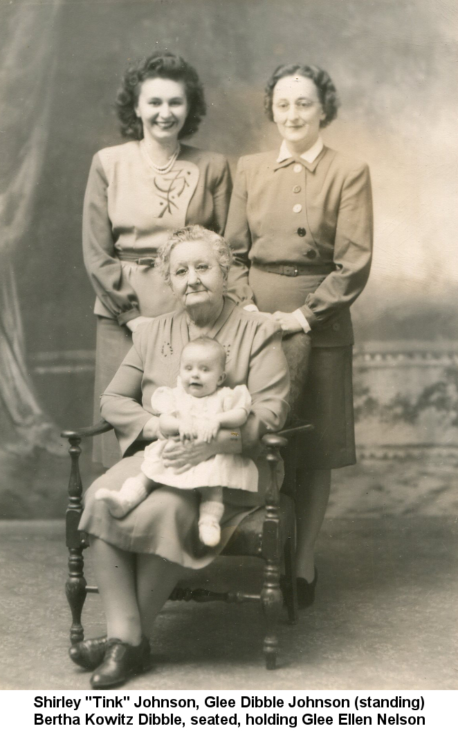 Black & white photo of Shirley 'Tink' Johnson and Glee Dibble Johnson standing behind Bertha Kowitz Dibble, who is seated, holding baby Glee Ellen Nelson