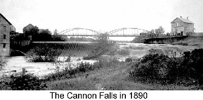 IMAGE/PHOTO: The Cannon Falls in 1890: Black and white photograph showing the falls of the Cannon River with a dam and suspension bridge