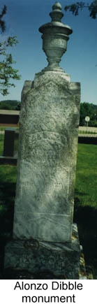 IMAGE/PHOTO: Alonzo Dibble Monument: Color photo of Alonzo Dibble's cemetery monument; it is tall and thin, of carved white marble, with aa carved chalice and finial at the top; the carved lettering is worn and difficult to read.
