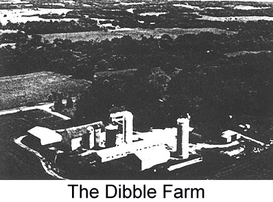 Black and white arial photograph of the Dibble farm, showing barns and outbuildings surrounded by rolling farmland